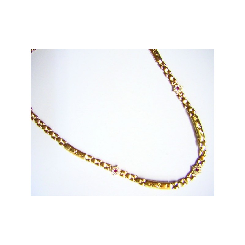 Collar de oro de 18 kl con flor de circonitas y rubí OCO/12