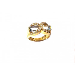 Anillo oro con piedra aguamarina y circonitas blancas formando el símbolo del infinito.